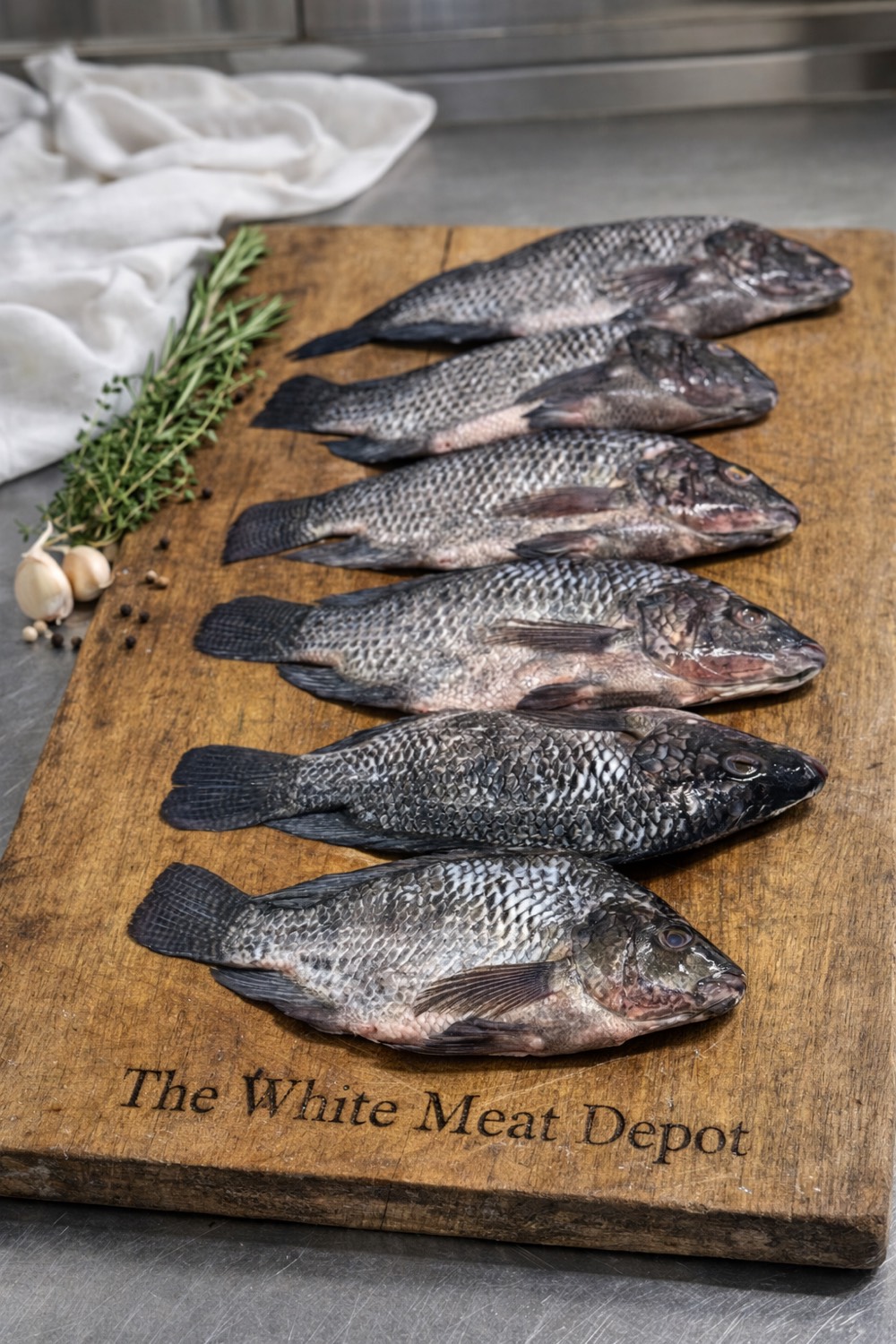 Raw Tilapia fish, scaled and cleaned, ready to cook